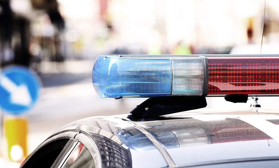 Michigan Police Officer Investigating A Car Accident Scene
